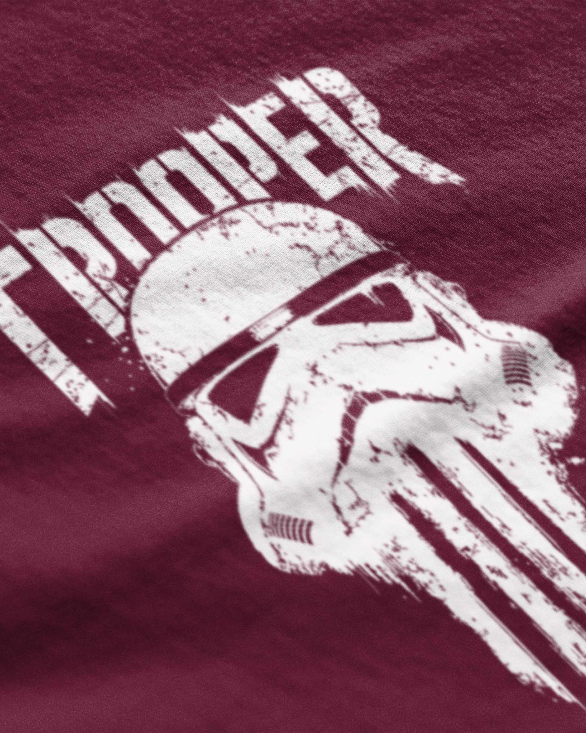 Maroon graphic t-shirt featuring a distressed white stormtrooper helmet and bold text design