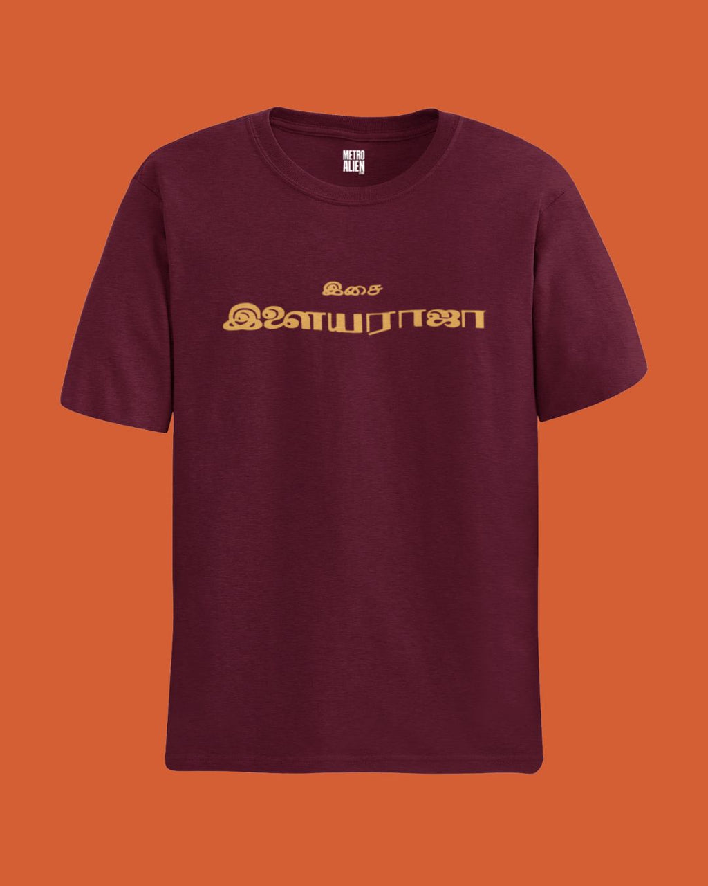 Maroon Ilaiyaraaja graphic t-shirt with gold Tamil text printed on front by METRO ALIEN
