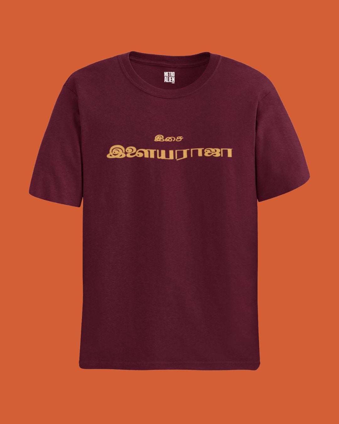 Maroon Ilaiyaraaja graphic t-shirt with gold Tamil text printed on front by METRO ALIEN
