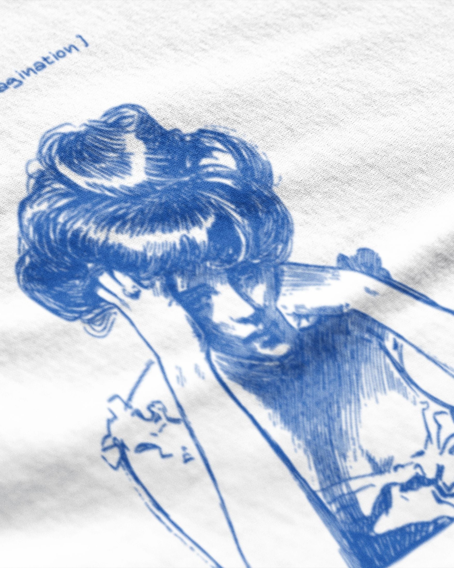 Close-up of white premium quality graphic tee with detailed blue artistic illustration