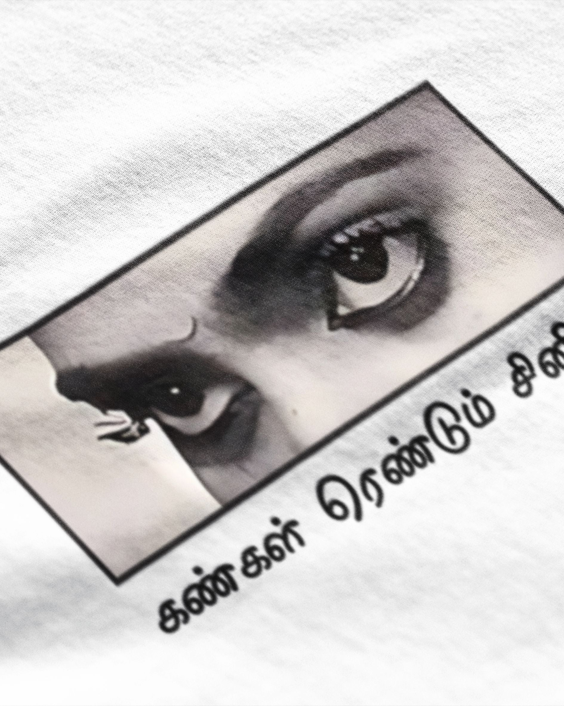 Metro Alien Tamil cinema graphic t-shirt featuring close-up of intense eyes and Tamil text on white fabric