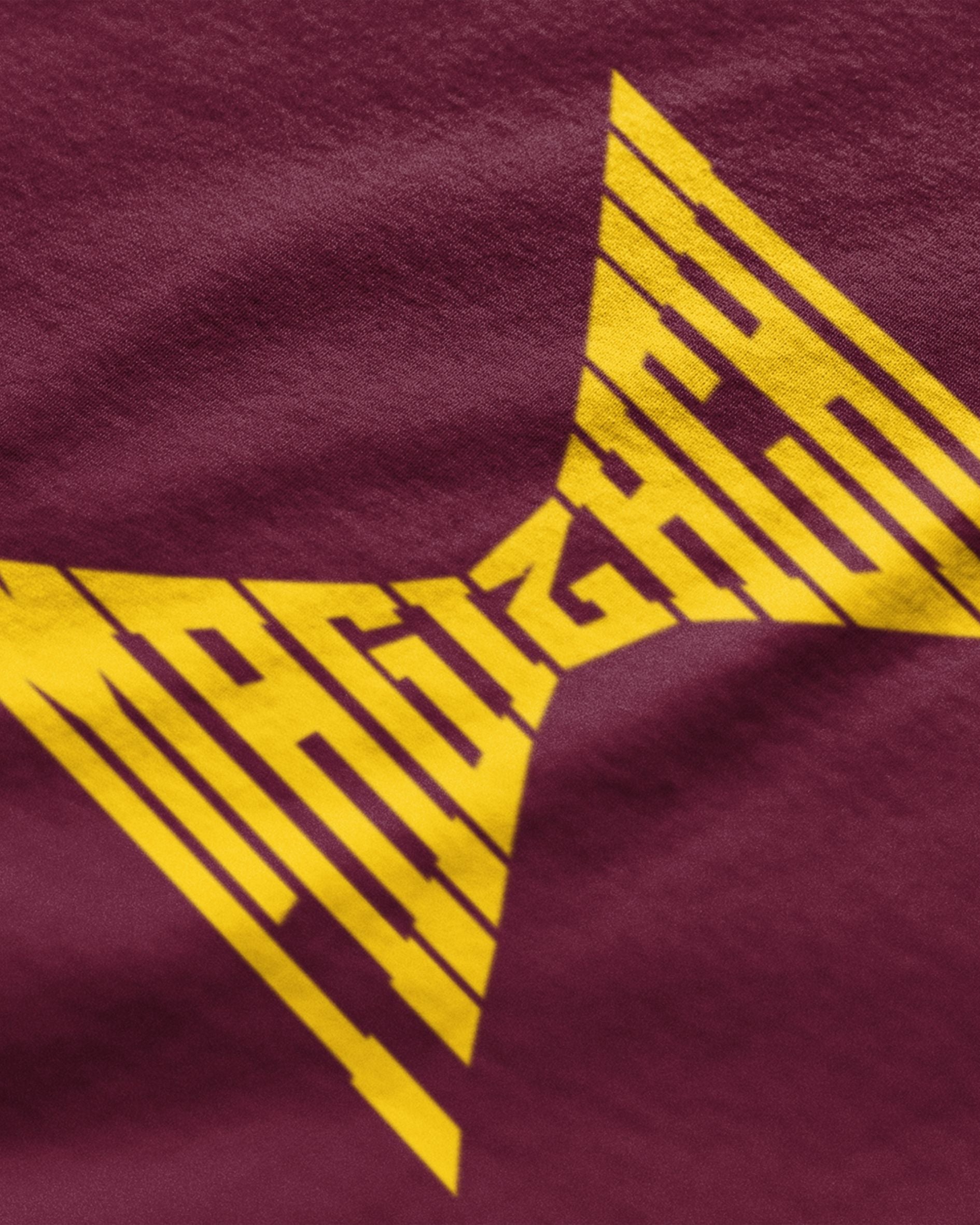 Maroon fabric with bold yellow Tamil graphic design text from cool tamil graphic t-shirts online by METRO ALIEN
