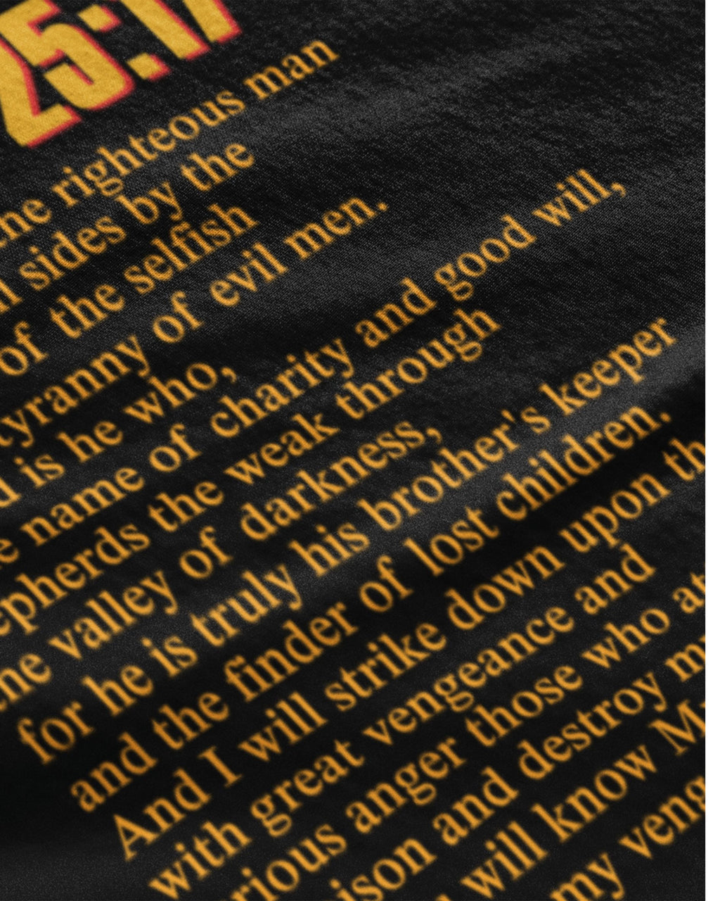Close-up of movie themed graphic streetwear t-shirt India pulp fiction tshirt india with yellow printed text on black fabric